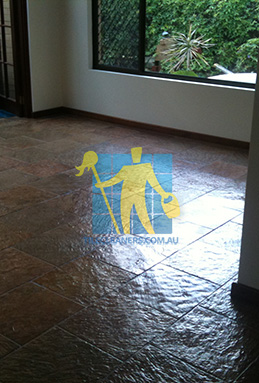 empty room with shiny slate tiles in empty room after sealing slate floors Sydney