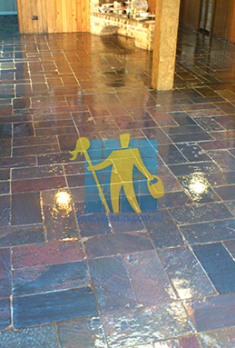 large area of slate tiles after sealing with glossy sealer empty room irregular pattern Sydney