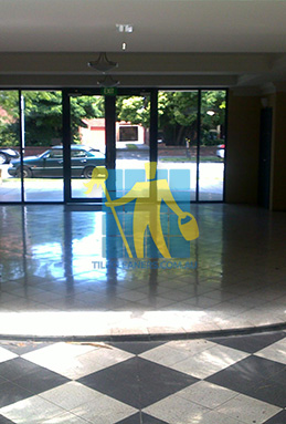terrazzo tiles building entrance empty before cleaning dirty shadow